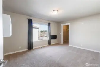 Bedroom 1 with a walk in closet