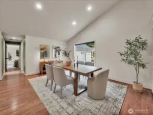 Formal dining space with modern décor and large picture window and serene outdoor views