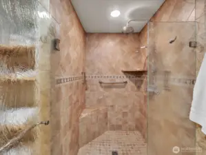 Luxury walk-in shower with tile surround and rainfall showerhead