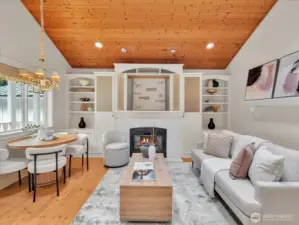 Light-filled cottage living space with fireplace and dining