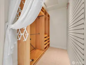 Spacious walk-in closet with custom built-in storage system