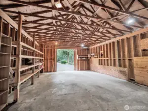Spacious workshop/garage with shelving and storage