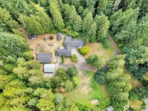 Drone shot of expansive property with multiple outbuildings