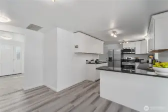 Elegant and spacious kitchen with large island bar and premium finishes