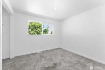 Main-level third bedroom plus there are also two additional bedrooms on the lower level for plenty of space