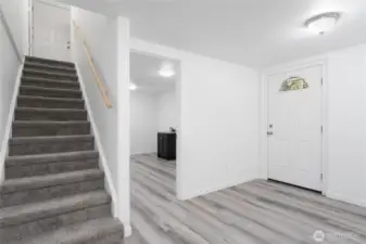 Heading downstairs, discover a second kitchen, two bedrooms, a huge family room, utility and storage spaces, a bathroom plus a separate entry on this level