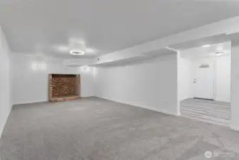 The perfect blend of comfort and income potential—separate-entry lower level with kitchen, two bedrooms, a bathroom and this massive family room