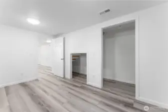 Comfortable and spacious, this lower-level bedroom is ideal for guests, teens, or tenants