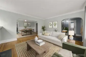Living room with view to dining room through the arch