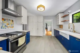 Kitchen view to adjacent dining room and showing built-in pantry on east wall of kitchen