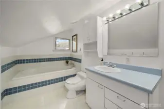 Bathroom two on upper floor offers soaking tub perfect for bathing little-ones.