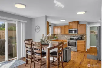 Dining room with sliders to outside patio.