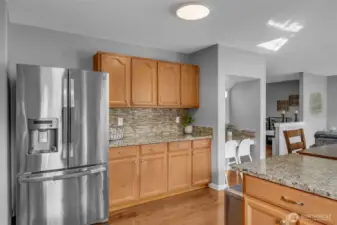 Fridge and additional cabinetry.