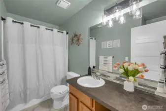 Full bathtub and great counter space for this bathroom.
