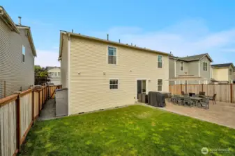 Left side of home with additional outbuilding included.