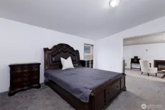 Primary bedroom, looking into the large added room.
