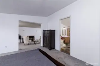 Primary bedroom, looking into the added room and the HUGE primary bathroom.