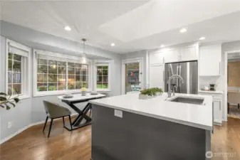 Overlooking the sunny eating nook and with access to the backyard, the kitchen is well-appointed.