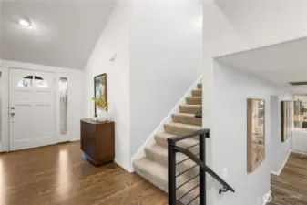 A view of the soaring entry. The railing and carpet were installed in the last few years.