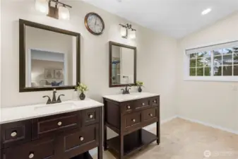 The primary bath offers dual sinks and extra space for to install a larger vanity or makeup area?
