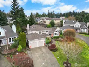 The property is sited at the end of the cul-de-sac with a long driveway for extra parking, front lawn and attached two car garage with E/V charging.