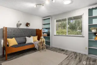 Third bedroom is large and has custom built in shelving