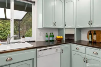 Beautifully painted cabinets adorned with new counter tops
