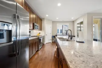 Expansive island, gas stove and built in microwave make this a great kitchen for entertaining.