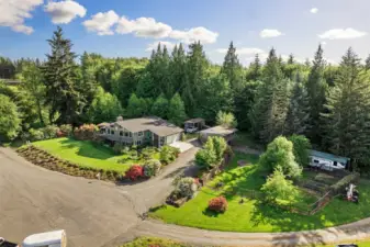 Check out the RV parking, fruit trees and gardens, shop with lots of extra covered parking, cul de sac, surrounded by nature, trees, this property has it all.