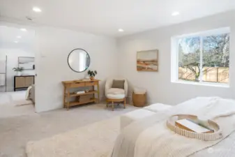 Primary bedroom off rec room with gorgeous morning light pouring in.