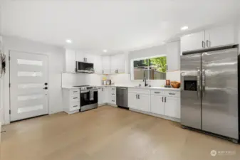 Brand new kitchen with shaker cabinets, 3cm quartz countertops, subway tile backsplash, under cabinet lighting, and stainless appliances.