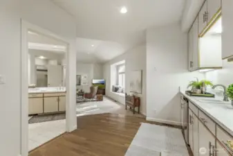 Large en-suite bonus room with closets, quartz wet bar area with beverage fridge, window seat with storage and a 3/4 bathroom.