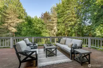 Extensive entertaining deck space with view of the gardens.
