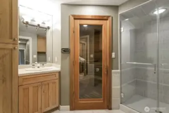 Lower level 3/4 bathroom with a sauna.