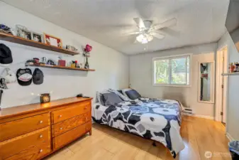 Primary bedroom with a private three quarter bath