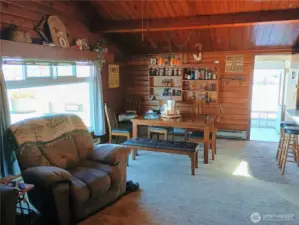 Living and dining area opens to front space.