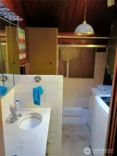 Full bath includes laundry area