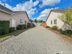 Walkway to large, fully-fenced seasonal community dog run