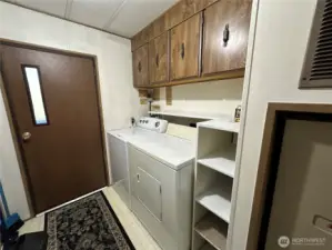 Laundry room and back door, washer and dryer are included in the sale.