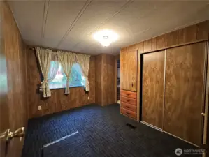 Bedroom 2 with new carpet and access to the guest bathroom