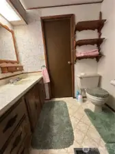 Guest bathroom opens into laundry room and bedroom 2