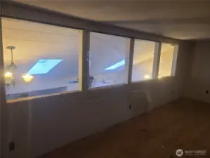 Upstairs bonus room looking over the Living room