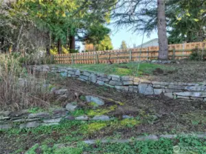 Fenced and terraced back yard