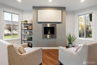 Cozy fireplace area between the Living Room/Dining Room