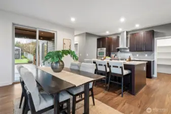A spacious, open-concept dining area seamlessly connects to the kitchen.