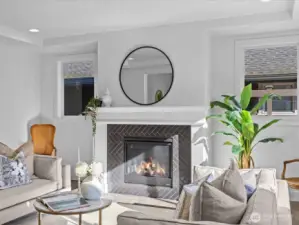 Cozy gas fireplace with tile surround offers warmth on cool evenings