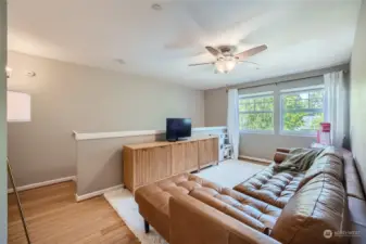 bamboo floors, ceiling fan & large windows make this a favorite room!