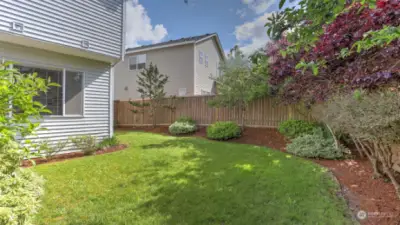 Plenty of lawn and flower bed space throughout this yard.