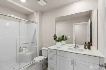 Primary Bathroom. Photos not of actual home. This is the same plan virtually staged. Plan, Colors, and options package may vary on actual home.