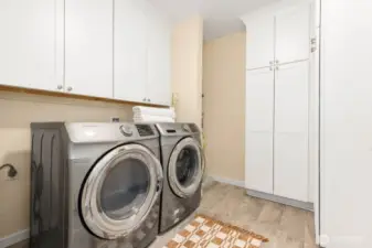 Utility room in a condo? Yes, we've got that.  No sliding doors or curtains here.  Newer Samsung washer and dryer, plenty of storage in your custom cabinets